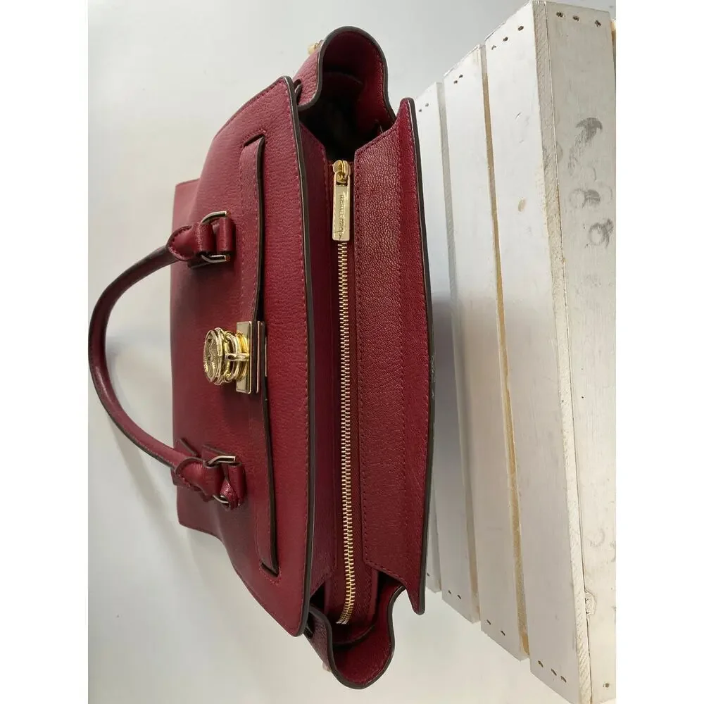 MICHAEL KORS, LARGE WINE LEATHER HANDBAG WITH LOCK CHARM.